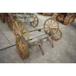Set of four matching cast wheels on axles. Suit shepherds hut.