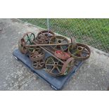 Pallet of various cast iron wheels.