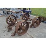 Set of four matching cast iron Foster of Lincoln steam traction wagon wheels. With axles and leaf
