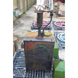 Castrol oil tank and pump.