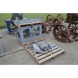 Cast iron rise and fall saw bench base. With parts.