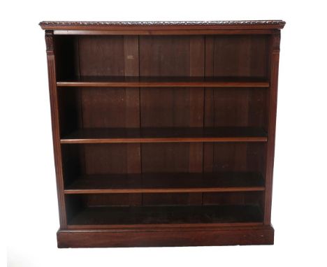 A Victorian Carved Walnut Free-Standing Open Bookcase, labelled James Shoolbred, Tottenham Court, London, 3rd quarter 19th ce
