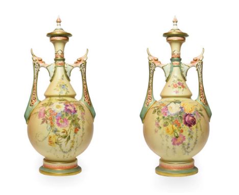 A Pair of Royal Worcester Porcelain Vases and Covers, circa 1905, of baluster form with pierced scroll and mask handles, pain