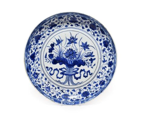 A Chinese Porcelain ''Lotus Bouquet'' Dish, in Yongle style, painted in underglaze blue with a ribbon tied bouquet of lotus f