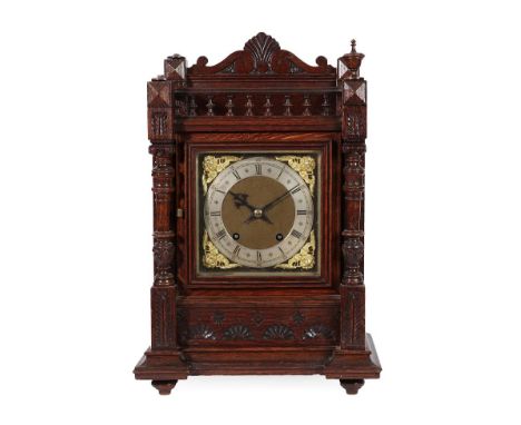 An Oak Quarter Striking Table Clock, circa 1890, top balustrade pediment, turned side columns, silvered Roman numeral chapter