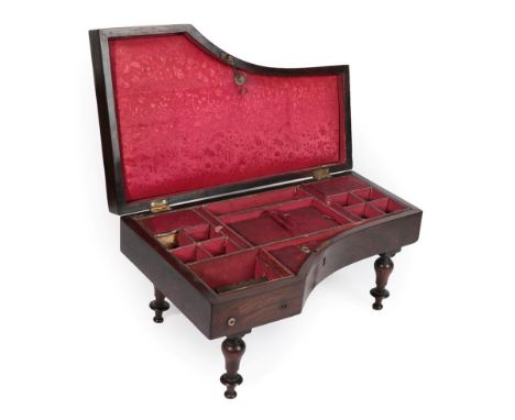A Rosewood Cased Musical Workbox, late 19th century, in the form of a piano with mother-of-pearl ''keys'', on baluster turned
