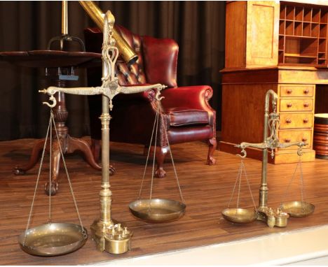 A Set of Portuguese Fishmonger's Brass Scales, 19th century, the beam, fulcrum and finial cast as fish, on fluted column and 