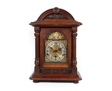 An Oak Quarter Striking Table Clock, circa 1890, arch pediment, brass dial with a silvered Arabic numeral chapter ring, tripl