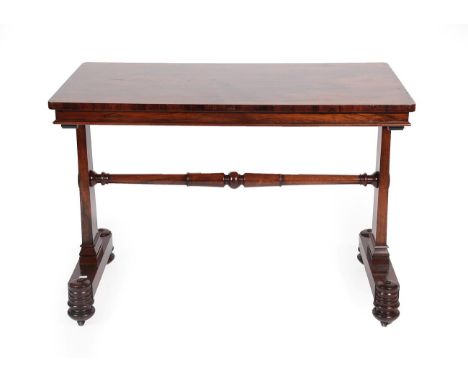 A William IV Rosewood Pillar-End Writing Table by T&amp;G Seddon, circa 1840, of rectangular form with moulded edge, on stand