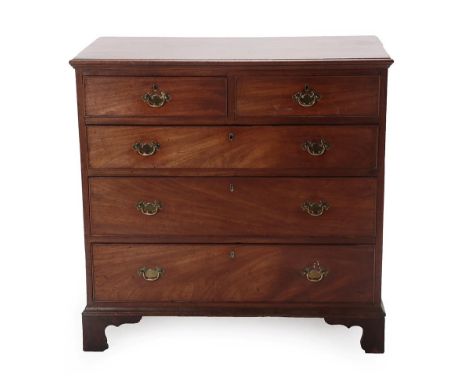 A George III Mahogany Straight Front Chest, late 18th century, the moulded top above two short and three long drawers with la
