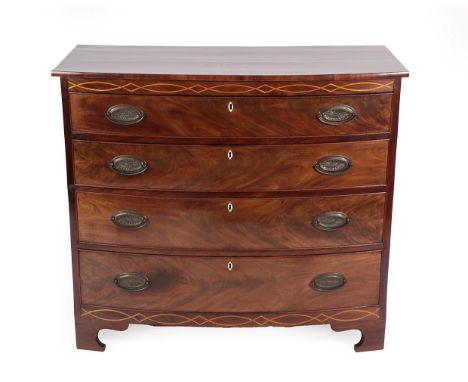 A George III Mahogany Bowfront Chest of Drawers, late 18th century, the strung frieze above four long graduated drawers with 