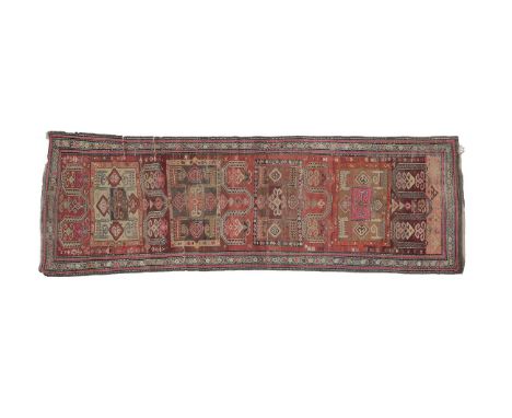 Karabagh Runner  South Caucasus, circa 1900 The abrashed terracotta field with tribal devices around four panels enclosed by 