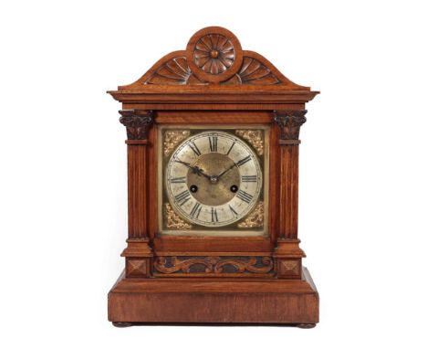 A Walnut Quarter Striking Mantel Clock, circa 1890, arched pediment, brass dial with a silvered Roman numeral chapter ring, t