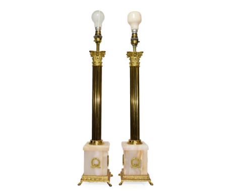 A Pair of Brass and Onyx Table Lamp Bases, 20th century, as Corinthian columns on square bases applied with laurel wreaths, o