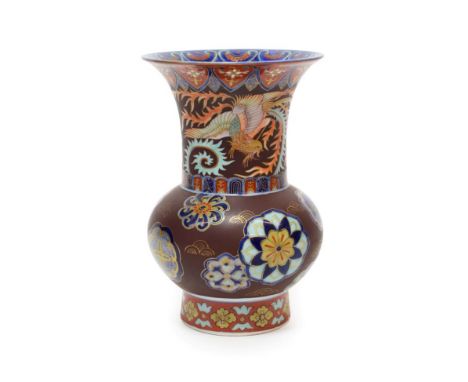 A Japanese Porcelain Vase, Meiji period, of ovoid form with trumpet neck, painted in imitation of cloisonné with a phoenix an