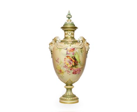 A Royal Worcester Porcelain Vase and Cover, 1897, the twin mask handles hung with swags, painted with flowersprays on a blush