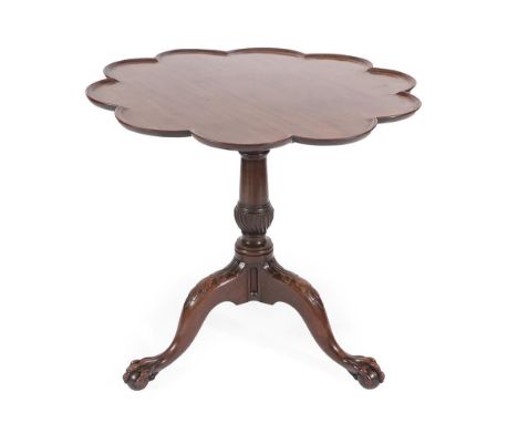 A George III Mahogany Flip Top Tripod Table, late 18th century, the moulded top above a birdcage platform, with a column and 