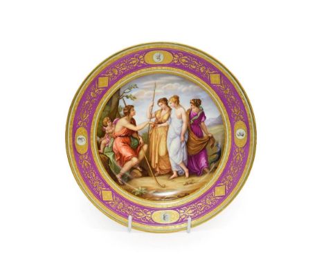 A Vienna Porcelain Plate, 1796, painted with The Judgement of Paris within a puce and green border with four grisaille profil