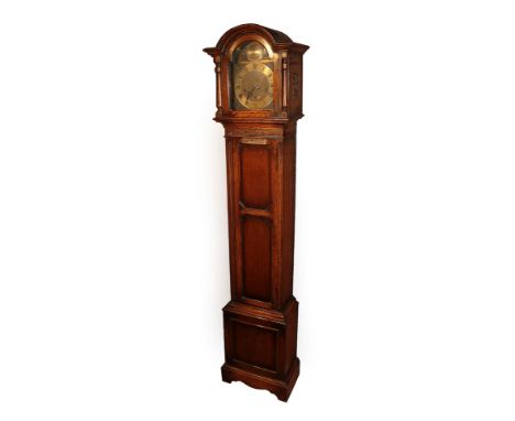 An Oak Chiming Small Longcase Clock, circa 1920, arch pediment, side sound frets, front door with a presentation plaque, trun