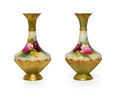 A Matched Pair of Royal Worcester Porcelain Vases, 1911/1912, of pear shape, painted with rose sprays within moulded and gilt