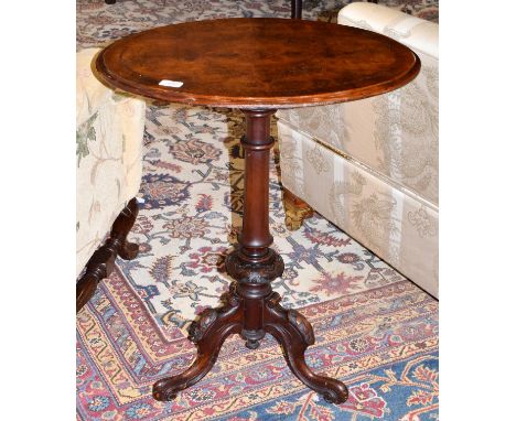 A Victorian Burr Walnut Oval Tripod Table, circa 1870, the circular moulded top with barber's pole stringing, on a baluster s