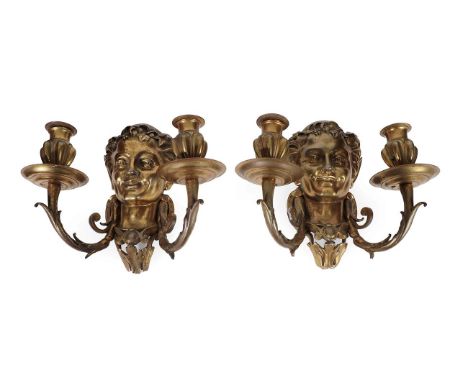 A Pair of Cast Brass Twin-Light Wall Lights, in 17th century style, with Bacchic masks issuing scroll branches and fluted soc