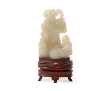 A Chinese Jade Figure Group, as a figure standing holding a vase of flowers, a child with a basket at his feet, 9cm high See 