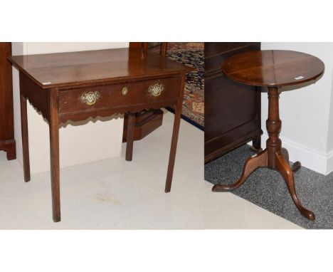 An Early 18th Century Oak Side Table, the two plank moulded top above a single frieze drawer and wavy shaped apron, on square