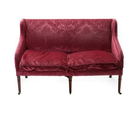 A George III Style Feather-Filled Two-Seater Sofa, covered in dark pink cut velvet, with two squab cushions above a plain sea