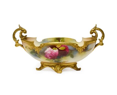 A Royal Worcester Porcelain Bowl, 1912, of lobed oval form with twin scroll handles, painted with rose sprays within moulded 