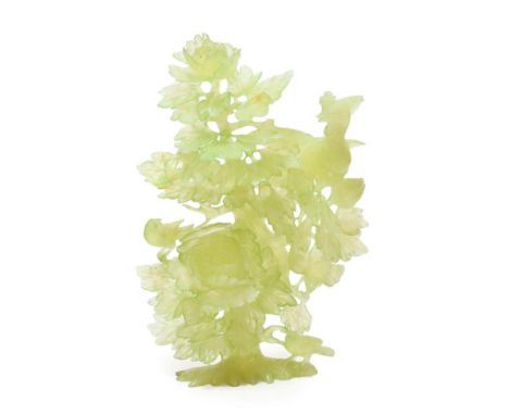 A Chinese Jade Group, as a pheasant perched in a flowering lotus tree, 24cm high.  Typical wear to gilding, surface scratchin