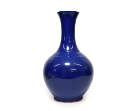 A Chinese Blue Glazed Porcelain Bottle Vase, 20th century, of ovoid form with trumpet neck, 39.5cm high.  Some typical minor 