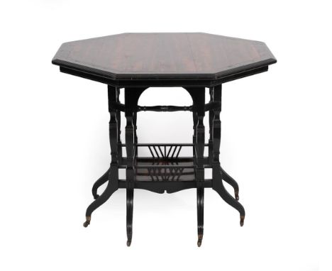 A Late 19th Century Ebonised and Marblewood Octagonal Shaped Centre Table, the moulded top on eight spindle legs joined by tu