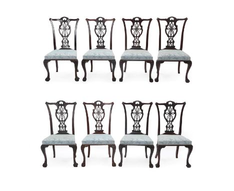 A Set of Eight Carved Mahogany Chippendale Style Dining Chairs, 19th century, recovered in blue floral fabric, with pierced a