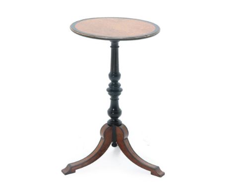 A Victorian Ebonised and Amboyna Circular Tripod Table, late 19th century, of circular form, on a turned and reeded support w