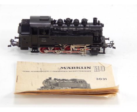 A Marklin tank locomotive, 3031, with booklet.