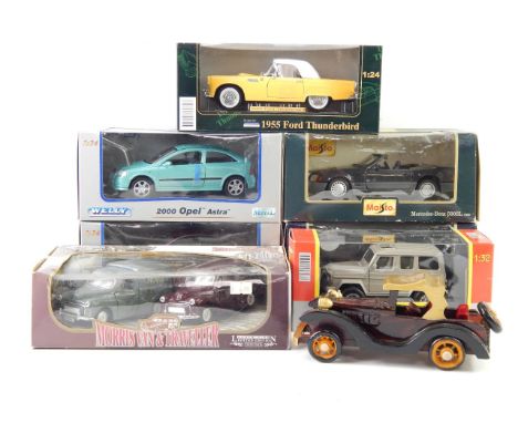 Seven die cast motor cars, and one wooden motor car, including a Maisto Mercedes Benz 500 SL 1898, and a Porsche 911 Speedste