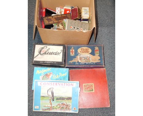 An early Waddington Ltd Cluedo game, GWR Cornwall jigsaw puzzle, further puzzles, cribbage board, trump marker and playing ca