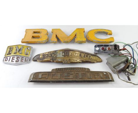 Car radiator name plates, including Morris Commercial and Austin, car badges and Humber car lettering.