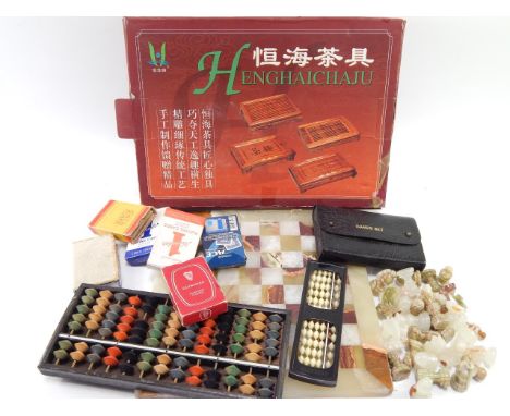 An onyx chess set and board, game of Enghaichaju, boxed, two abacuses and sundry playing card sets, (qty).