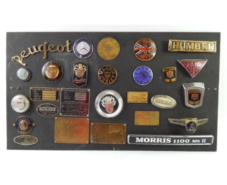 A collection of rare car badges and chassis plates, including Lloyd Cars of Grimsby, A Smiths & Sons of Chippenham, J Clayton