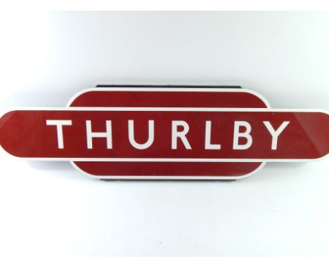 A Thurlby railway sign, By Trackside, red and white enamel, 91.5cm x 25.5cm.