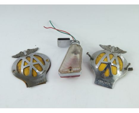 Two AA car badges, 0751982 and 7B92931, together with a Sedan indicator light.