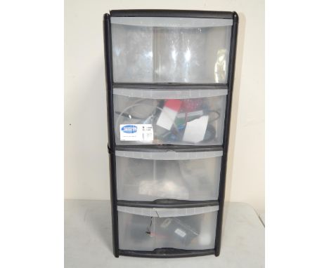 A four drawer chest of tools and spares, related to remote control aircraft, and a further box of parts.
