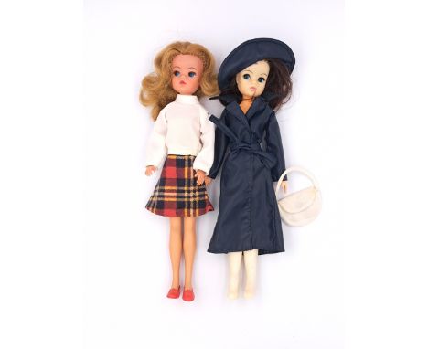 Pedigree Sindy pair of vintage 1970s dolls: (1) Sindy doll, dark blonde, wearing Tartan Twins 1975, right foot nibbled; (2) S