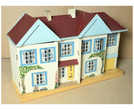 Triang CEX vintage Dolls House, 1963, well made in hardboard, opens at front in two sections, with four rooms on two storeys,