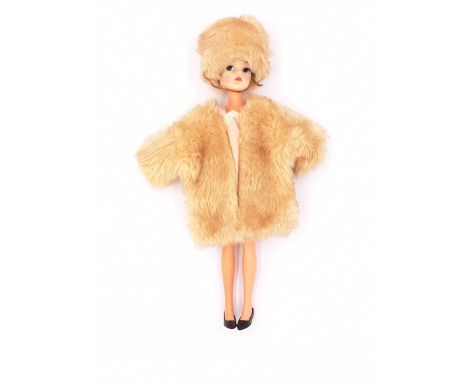 Pedigree Sindy centre part vintage doll, brunette (hair distressed and some plugs missing), wearing Fun Furs light beige, tip