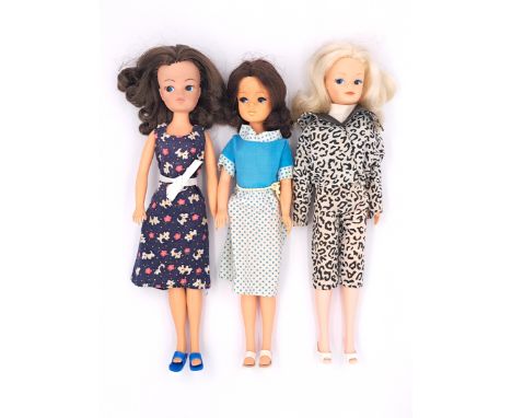 Pedigree Sindy three vintage 1980s dolls: (1) 1982 John Menzies scotty dog shift dress (dark blue); (2) 1981 Funtime Sindy dr