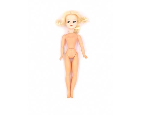 Pedigree Sindy centre part vintage doll, blonde, wearing 1971 Sweet Dreams, waist joint is loose, Good to Excellent.