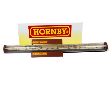 A Hornby 00 Gauge Shop Display, comprising a one metre length of clear plastic tubing with a length of rail  and simple backs